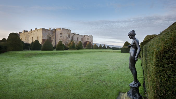 A view across the garden towards the castle at Chirk Castle in Wrexham